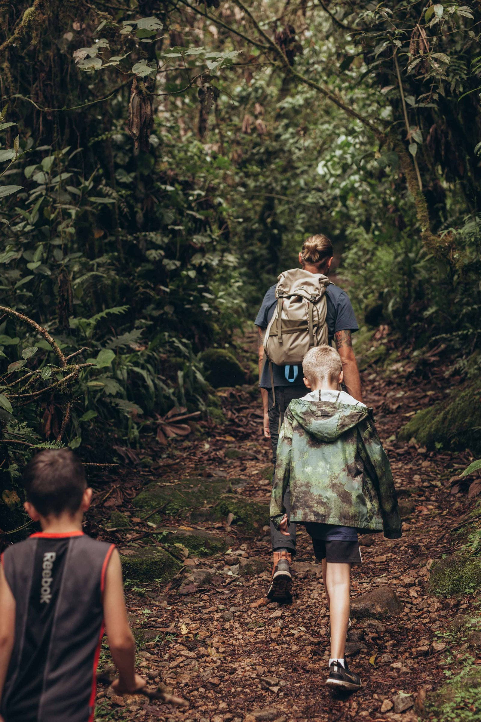 family walking on a trail