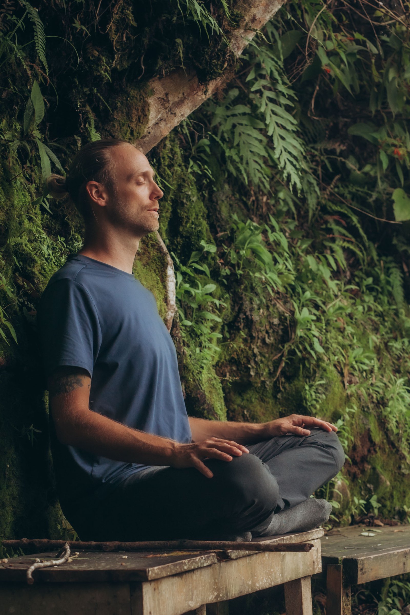 male doing a meditation session in nature